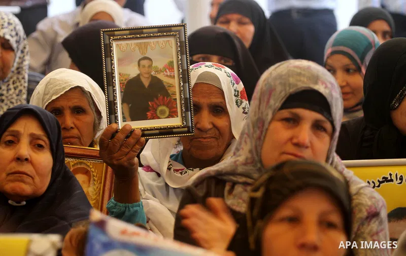 Palestinian women shout slogans during a demonstration for the release of Palestinian prisoners held in Israeli jails outside the Red Cross offices in Gaza City on April 23, 2012. At least 1,350 Palestinian prisoners bei...