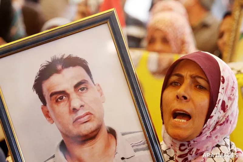 Palestinian women shout slogans during a demonstration for the release of Palestinian prisoners held in Israeli jails outside the Red Cross offices in Gaza City on April 23, 2012. At least 1,350 Palestinian prisoners bei...