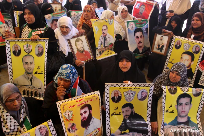 Palestinian women shout slogans during a demonstration for the release of Palestinian prisoners held in Israeli jails outside the Red Cross offices in Gaza City on April 23, 2012. At least 1,350 Palestinian prisoners bei...