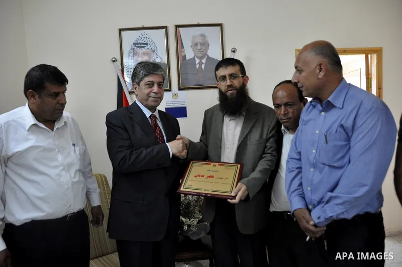 Palestinian Khader Adnan, a senior member of Islamic Jihad, who didn't eat for 66 days, was set to be freed later as part of a deal reached with Israel, during a ceremony honoring from province of Tubas, in the West Bank...