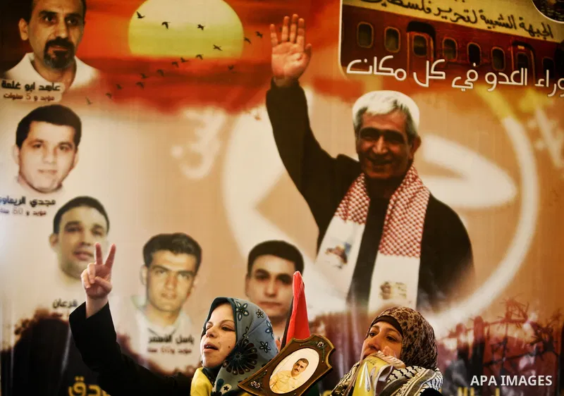 Palestinian women shout slogans during a demonstration for the release of Palestinian prisoners held in Israeli jails outside the Red Cross offices in Gaza City on April 23, 2012. At least 1,350 Palestinian prisoners bei...