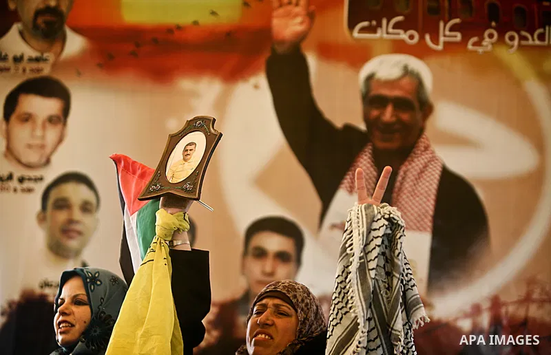 Palestinian women shout slogans during a demonstration for the release of Palestinian prisoners held in Israeli jails outside the Red Cross offices in Gaza City on April 23, 2012. At least 1,350 Palestinian prisoners bei...