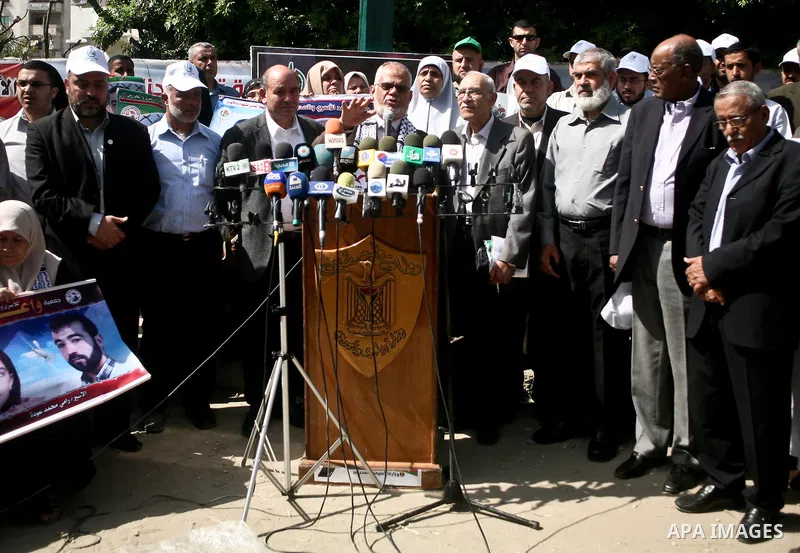Palestinians take part in a press conference during a demonstration for the release of Palestinian prisoners held in Israeli jails outside the Red Cross offices in Gaza City on April 23, 2012. Photo by Ali Jadallah