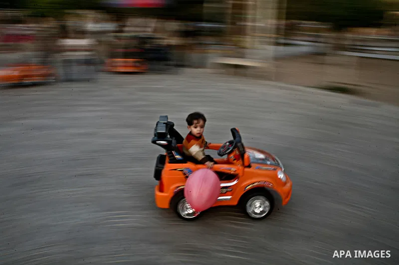Palestinian children play in a garden in Gaza city, 23 April 2012. With high rates of unemployment in Gaza strip. Photo by Ali Jadallah
