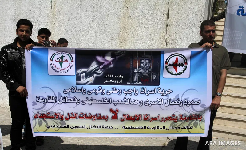 Palestinians of the Al-Ahrar Brigades, take part a protest calling for the release of Palestinian prisoners held in Israeli jails outside the Legislative Council in Gaza City on April 24, 2012 in solidarity with Palestin...