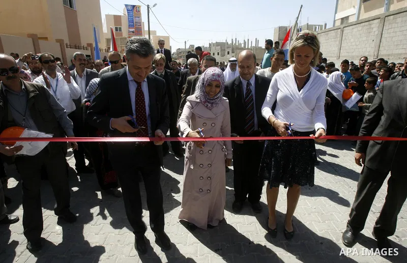 Birgitta Tazelaar head of the Netherlands Representation to the Palestinian Authority, alongside UNRWA's Filippo Grandi, during a ceremony in Khan Younis, in the southern Gaza Strip, on April 24, 2012. Palestinians whose...