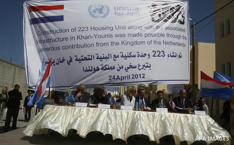 Birgitta Tazelaar head of the Netherlands Representation to the Palestinian Authority, alongside UNRWA's Filippo Grandi, during a ceremony in Khan Younis, in the southern Gaza Strip, on April 24, 2012. Palestinians whose...