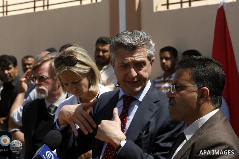 Birgitta Tazelaar head of the Netherlands Representation to the Palestinian Authority, alongside UNRWA's Filippo Grandi, during a ceremony in Khan Younis, in the southern Gaza Strip, on April 24, 2012. Palestinians whose...
