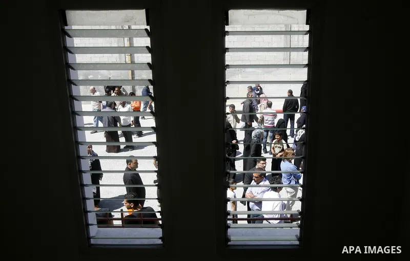 Palestinians take part a ceremony distributing new homes in Khan Younis in the southern Gaza Strip April 24, 2012. Palestinians, whose houses were destroyed during Israeli military operations in 2004 and 2005, received a...