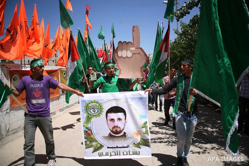 Palestinian students supporters of the Islamic group Hamas, seen during Palestine Polytechnic University. Students Council elections campaign at the Palestine Polytechnic University in the West Bank city of Hebron on Apr...