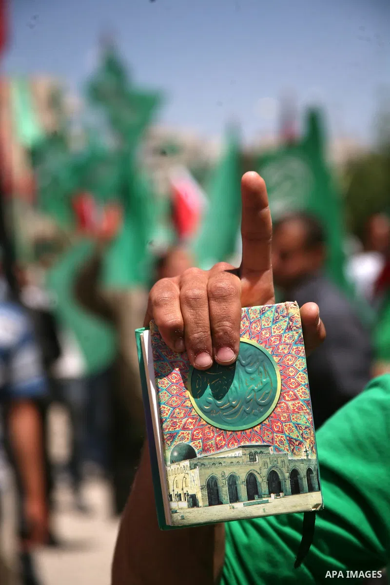 Palestinian students supporters of the Islamic group Hamas, seen during Palestine Polytechnic University. Students Council elections campaign at the Palestine Polytechnic University in the West Bank city of Hebron on Apr...