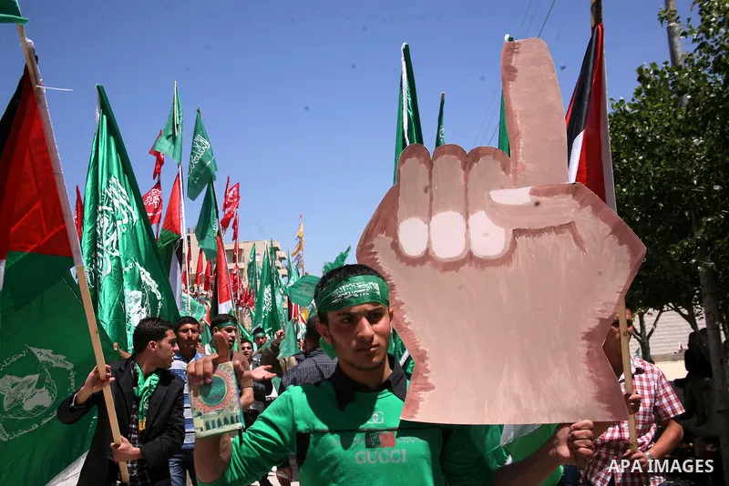 Palestinian students supporters of the Islamic group Hamas, seen during Palestine Polytechnic University. Students Council elections campaign at the Palestine Polytechnic University in the West Bank city of Hebron on Apr...
