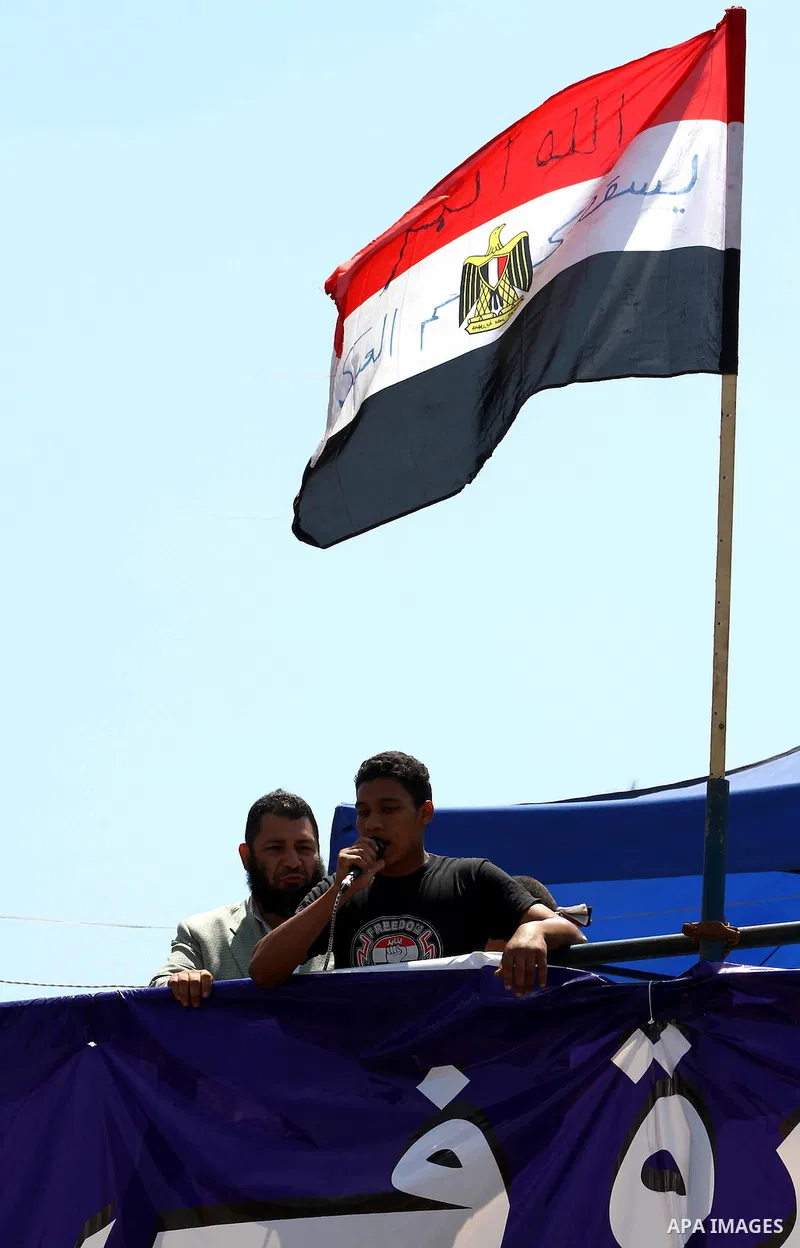 Egyptian demonstrators chant slogans during a protest at Tahrir Square in Cairo, Egypt on April 25, 2012. Several thousand Egyptians are protesting against the country's military rulers. Photo by Ashraf Amra