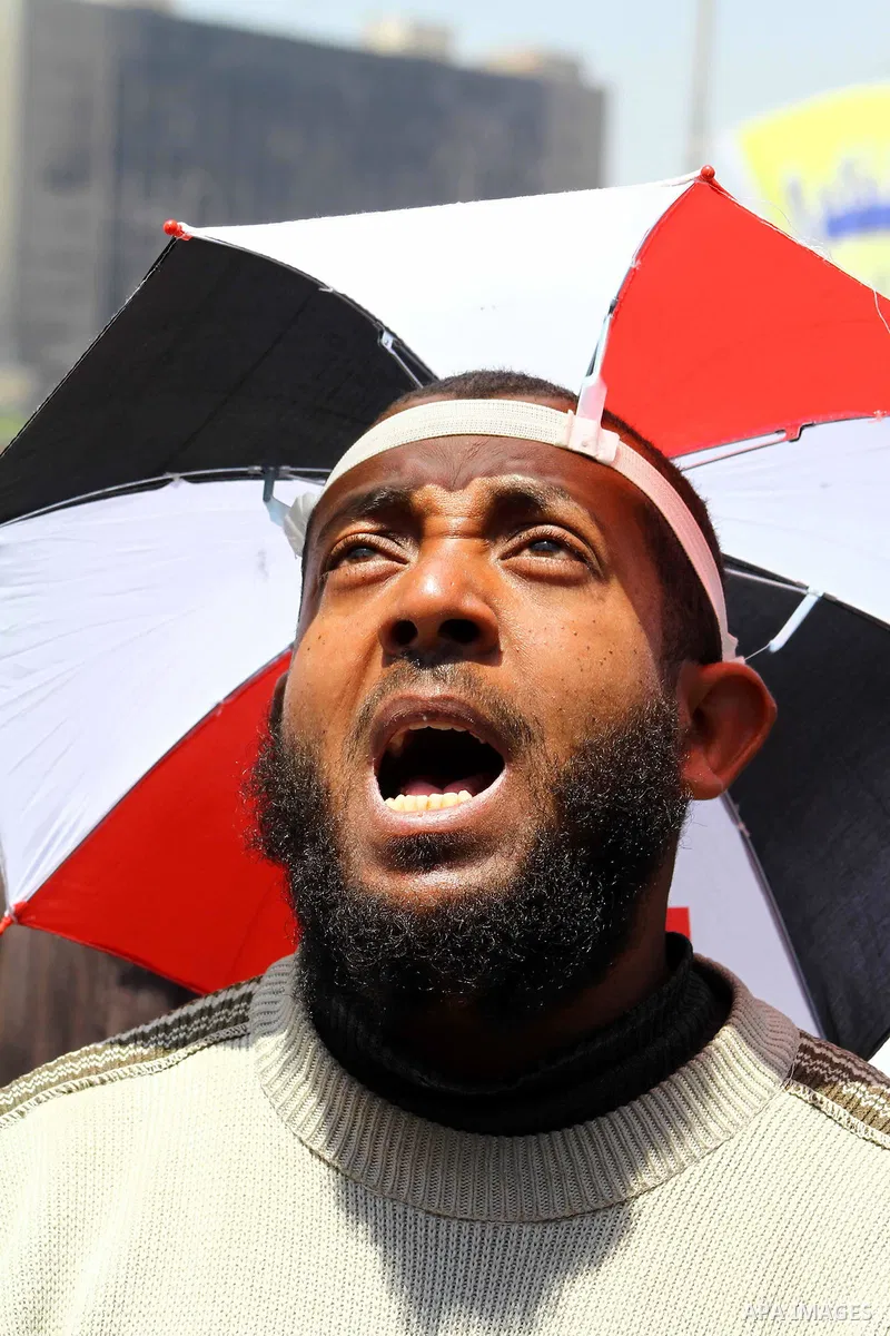 Egyptian demonstrators chant slogans during a protest at Tahrir Square in Cairo, Egypt on April 25, 2012. Several thousand Egyptians are protesting against the country's military rulers. Photo by Ashraf Amra