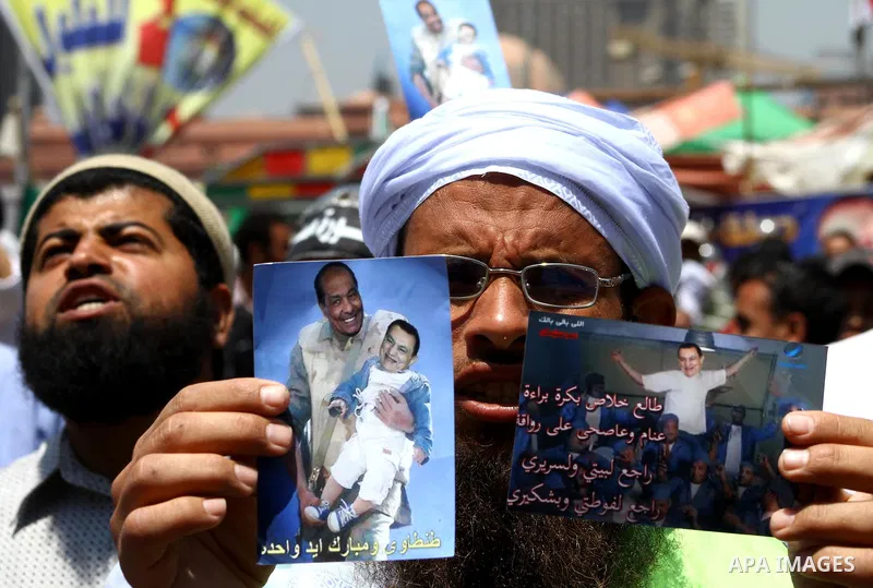 Egyptian demonstrators chant slogans during a protest at Tahrir Square in Cairo, Egypt on April 25, 2012. Several thousand Egyptians are protesting against the country's military rulers. Photo by Ashraf Amra