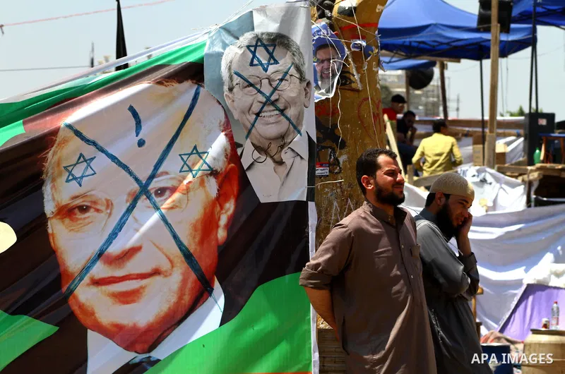 Egyptian demonstrators holding up portraits during a protest at Tahrir Square in Cairo, Egypt on April 25, 2012. Several thousand Egyptians are protesting against the country's military rulers. Photo by Ashraf Amra