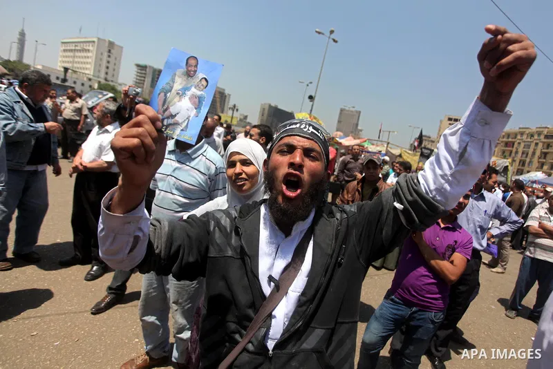 Egyptian demonstrators chant slogans during a protest at Tahrir Square in Cairo, Egypt on April 25, 2012. Several thousand Egyptians are protesting against the country's military rulers. Photo by Ashraf Amra