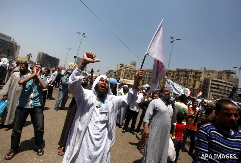 Egyptian demonstrators chant slogans during a protest at Tahrir Square in Cairo, Egypt on April 25, 2012. Several thousand Egyptians are protesting against the country's military rulers. Photo by Ashraf Amra