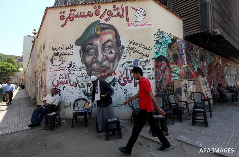 Egyptian demonstrators (not seen) chant slogans during a protest at Tahrir Square in Cairo, Egypt on April 25, 2012. Several thousand Egyptians are protesting against the country's military rulers. Photo by Ashraf Amra