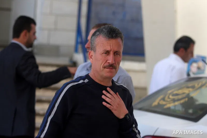 Palestinian activist Bassem Tamimi with his relatives at a hospital in Ramallah on April 25, 2012, after a military court released him on bail on April 24, ahead of the verdict in his trial on charges of organising popul...
