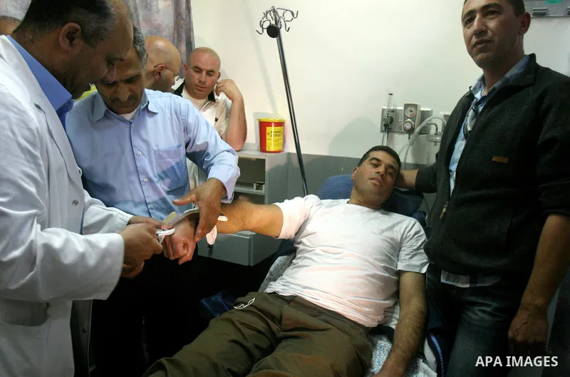 Palestinians prisoner, Tawfiq Iwisaat, in a hospital as while his release from Israeli jail after 18 years of imprisonment in the Arab east Jerusalem neighbourhood of Jabal Mukaber on April 25, 2012. Photo by Mahfouz Abu...