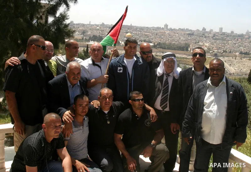 Palestinians celebrate the release of Tawfiq Iwisaat following his release from Israeli jail after 18 years of imprisonment in the Arab east Jerusalem neighbourhood of Jabal Mukaber on April 25, 2012. Photo by Mahfouz Ab...