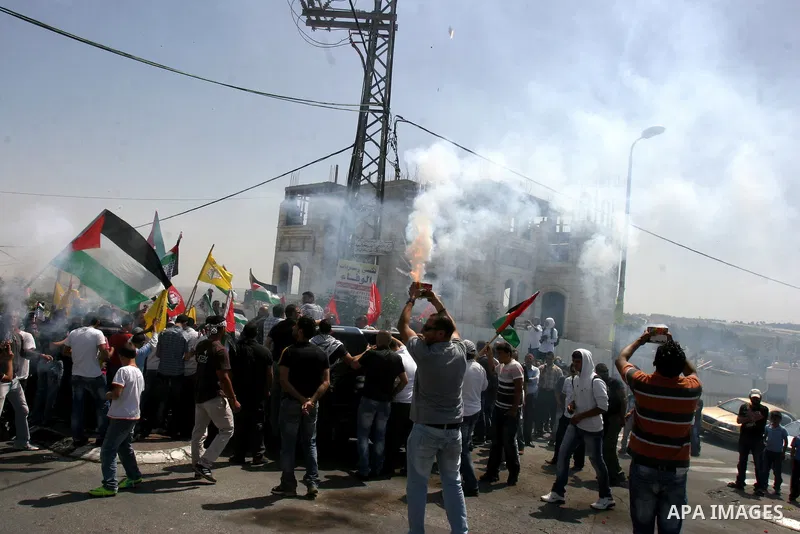 Palestinians celebrate the release of Tawfiq Iwisaat following his release from Israeli jail after 18 years of imprisonment in the Arab east Jerusalem neighbourhood of Jabal Mukaber on April 25, 2012. Photo by Mahfouz Ab...