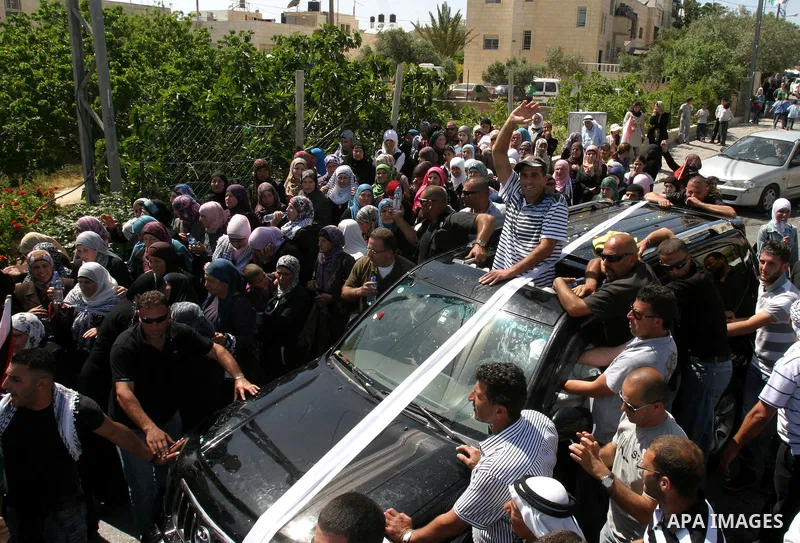 Palestinians celebrate the release of Tawfiq Iwisaat following his release from Israeli jail after 18 years of imprisonment in the Arab east Jerusalem neighbourhood of Jabal Mukaber on April 25, 2012. Photo by Mahfouz Ab...