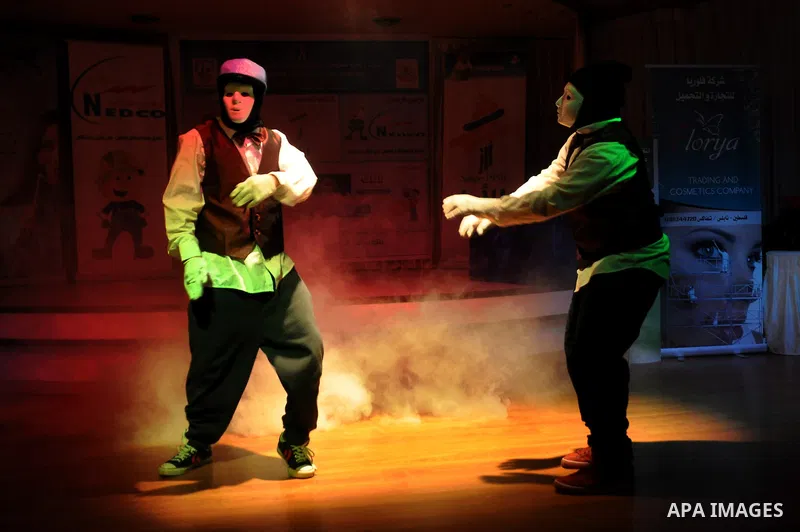 Palestinians performs dance during festival for children in the West Bank city of Nablus, on April 25, 2012. Photo by Nedal Eshtayah
