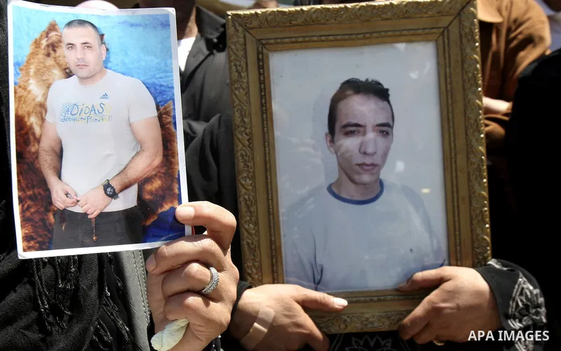 Palestinians hold up portraits of prisoners jailed in Israel during a demonstration calling for their release, in the West Bank city of Nablus on April 25, 2012. Photo by Wagdi Eshtayah