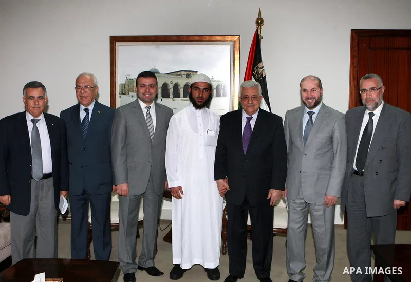 Palestinian President, Mahmoud Abbas (Abu Mazen), meets with Daoud Abayat first place winner in the Islamic world in the Contest of memorizing the Holy Quran, in the West bank City of Ramallah, on April 26, 2012. Photo b...
