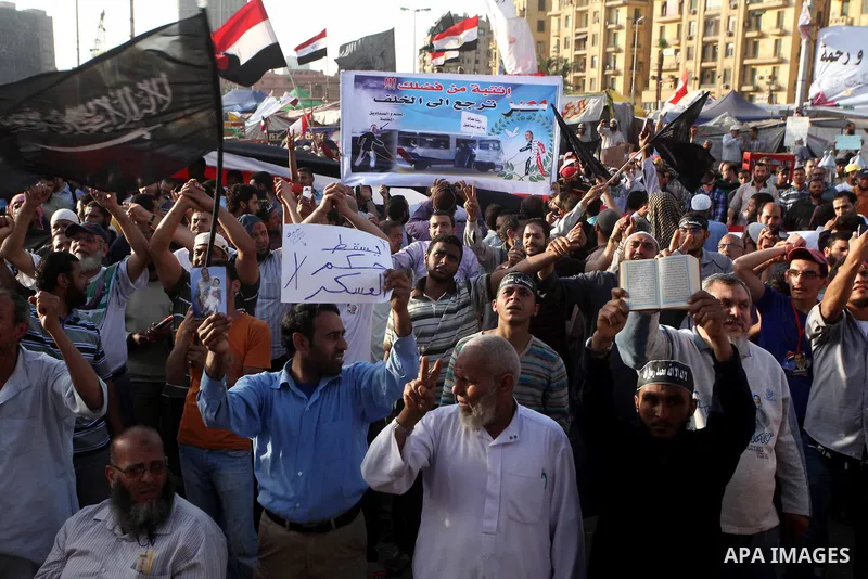 Supporters of Salafist leader and former presidential candidate Hazem Salah Abu Ismail, chant slogans against the country's military rulers during a sit-in at Tahrir Square in Cairo, April 26, 2012. Egypt's election comm...