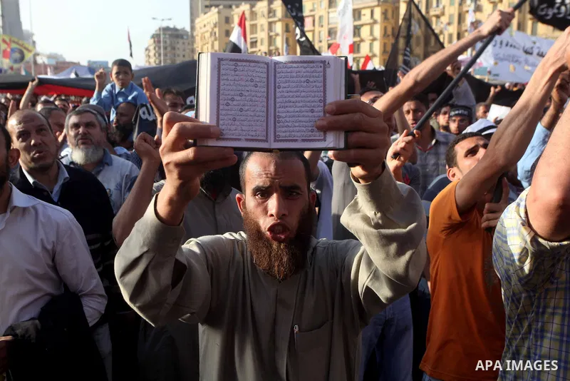 Supporters of Salafist leader and former presidential candidate Hazem Salah Abu Ismail, chant slogans against the country's military rulers during a sit-in at Tahrir Square in Cairo, April 26, 2012. Egypt's election comm...
