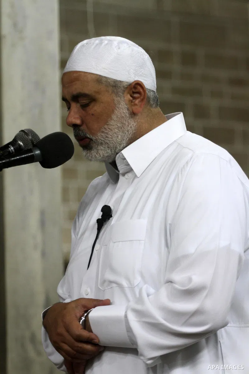 Palestinian Prime Minister in Gaza Ismail Hania, attend by Legislative Council members, Ministers and Clerics in Gaza, during a prayer for the prisoners in Israeli jails. in Gaza city on April 26, 2012.. Photo by Mohamme...