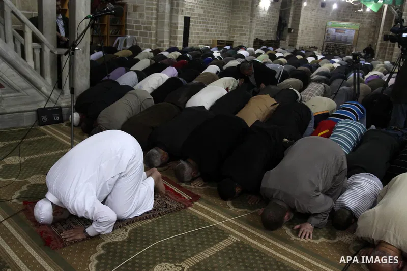 Palestinian Prime Minister in Gaza Ismail Hania, attend by Legislative Council members, Ministers and Clerics in Gaza, during a prayer for the prisoners in Israeli jails. in Gaza city on April 26, 2012.. Photo by Mohamme...