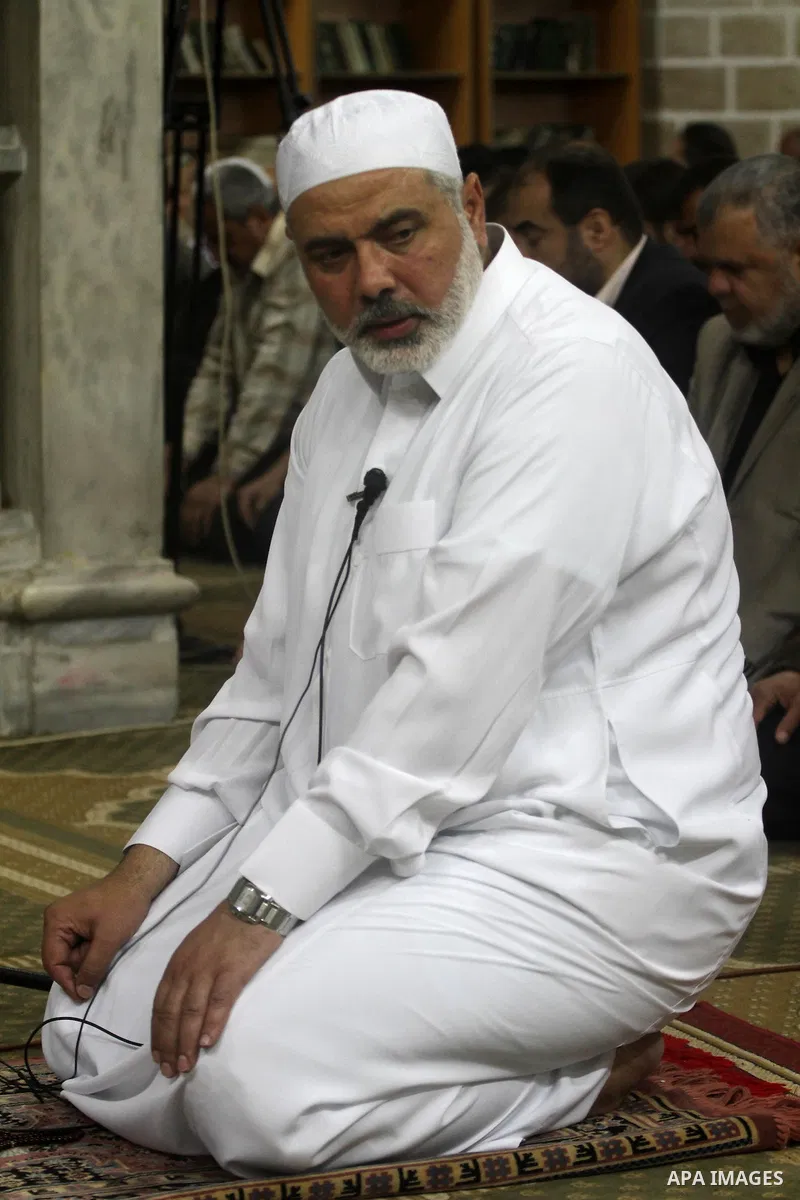 Palestinian Prime Minister in Gaza Ismail Hania, attend by Legislative Council members, Ministers and Clerics in Gaza, during a prayer for the prisoners in Israeli jails. in Gaza city on April 26, 2012.. Photo by Mohamme...