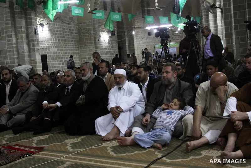 Palestinian Prime Minister in Gaza Ismail Hania, attend by Legislative Council members, Ministers and Clerics in Gaza, during a prayer for the prisoners in Israeli jails. in Gaza city on April 26, 2012.. Photo by Mohamme...