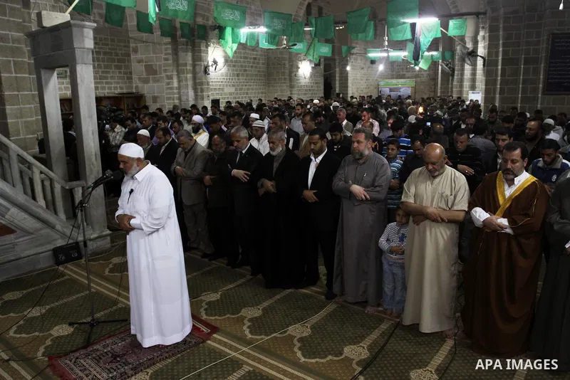 Palestinian Prime Minister in Gaza Ismail Hania, attend by Legislative Council members, Ministers and Clerics in Gaza, during a prayer for the prisoners in Israeli jails. in Gaza city on April 26, 2012.. Photo by Mohamme...
