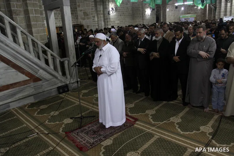 Palestinian Prime Minister in Gaza Ismail Hania, attend by Legislative Council members, Ministers and Clerics in Gaza, during a prayer for the prisoners in Israeli jails. in Gaza city on April 26, 2012.. Photo by Mohamme...
