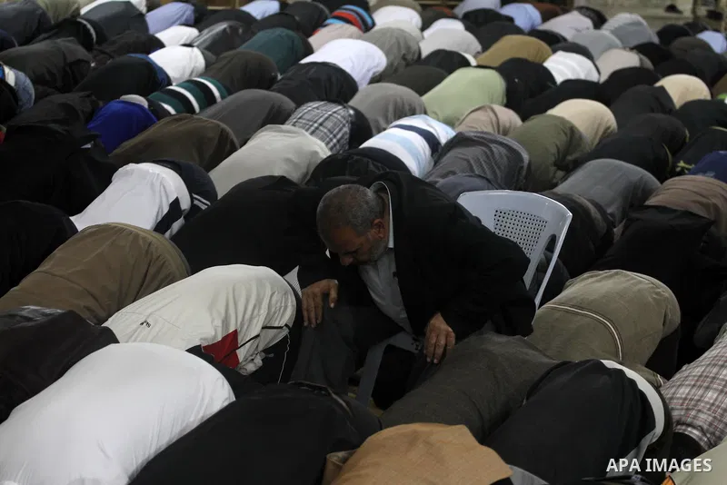 Palestinian Prime Minister in Gaza Ismail Hania (not seen), attend by Legislative Council members, Ministers and Clerics in Gaza, during a prayer for the prisoners in Israeli jails. in Gaza city on April 26, 2012.. Photo...