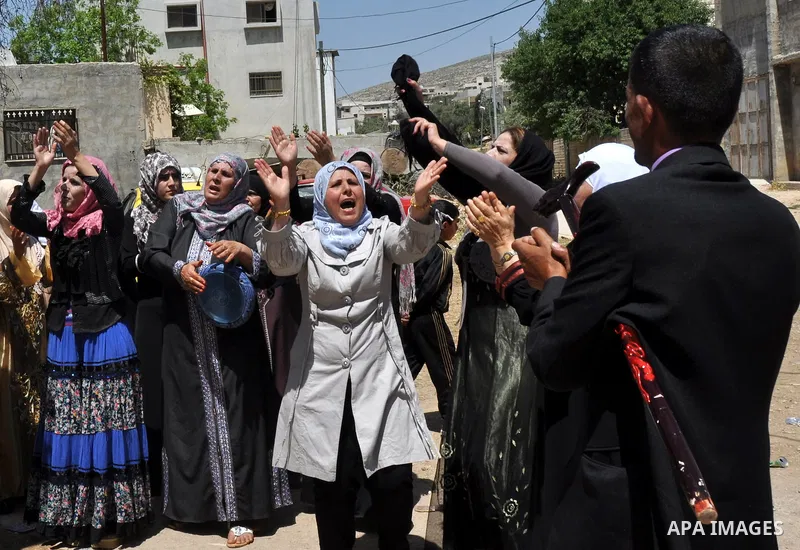 Relatives Palestinian groom Abbas Thawabteh, dancing during heritage wedding in the village of Azmut eastern city of Nablus in the West Bank,on 27 April 2012. Photo by Nedal Shtieh. Photo by Nedal Shtieh