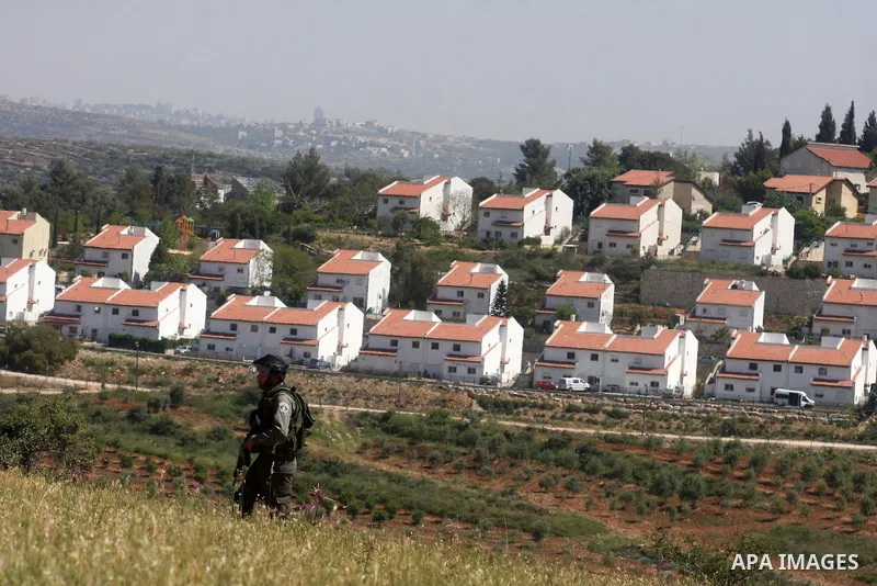 Palestinian youths and Israeli troops clash during a weekly demonstration against the expansion of the nearby Jewish settlement of Halamish in the West Bank village of Nabi Saleh near Ramallah, Friday, April 27, 2012. Ph...