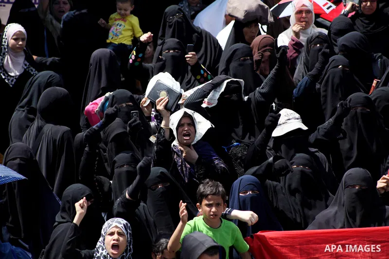People attend Friday prayers in Tahrir Square in Cairo April 27, 2012. Tens of thousands of Egyptians demanded on Friday that their military rulers stick to a pledge to hand over power by mid-year after a row over who ca...