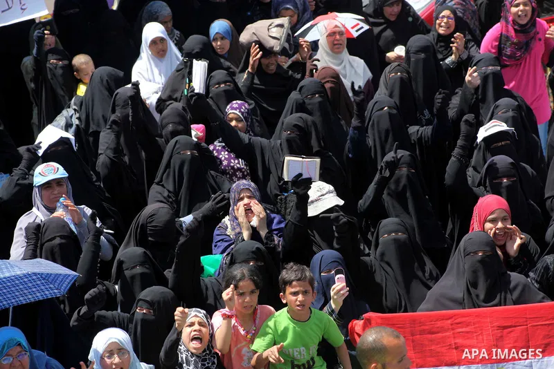People attend Friday prayers in Tahrir Square in Cairo April 27, 2012. Tens of thousands of Egyptians demanded on Friday that their military rulers stick to a pledge to hand over power by mid-year after a row over who ca...