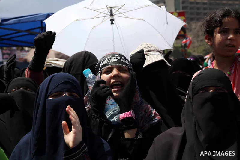 People attend Friday prayers in Tahrir Square in Cairo April 27, 2012. Tens of thousands of Egyptians demanded on Friday that their military rulers stick to a pledge to hand over power by mid-year after a row over who ca...