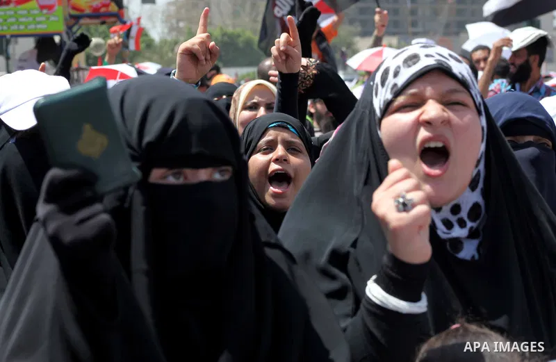 People attend Friday prayers in Tahrir Square in Cairo April 27, 2012. Tens of thousands of Egyptians demanded on Friday that their military rulers stick to a pledge to hand over power by mid-year after a row over who ca...