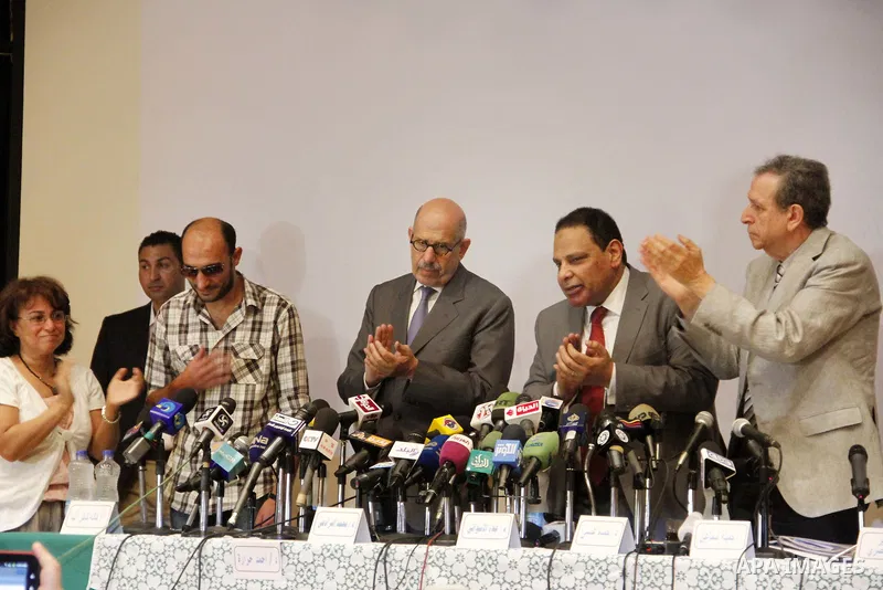 Egyptian Nobel Peace Prize winner and former head of the International Atomic Energy Agency, Mohamed ElBaradei addresses a press conference with novelist Alaa al-Aswany and other personalities, at the Egyptian Press Synd...