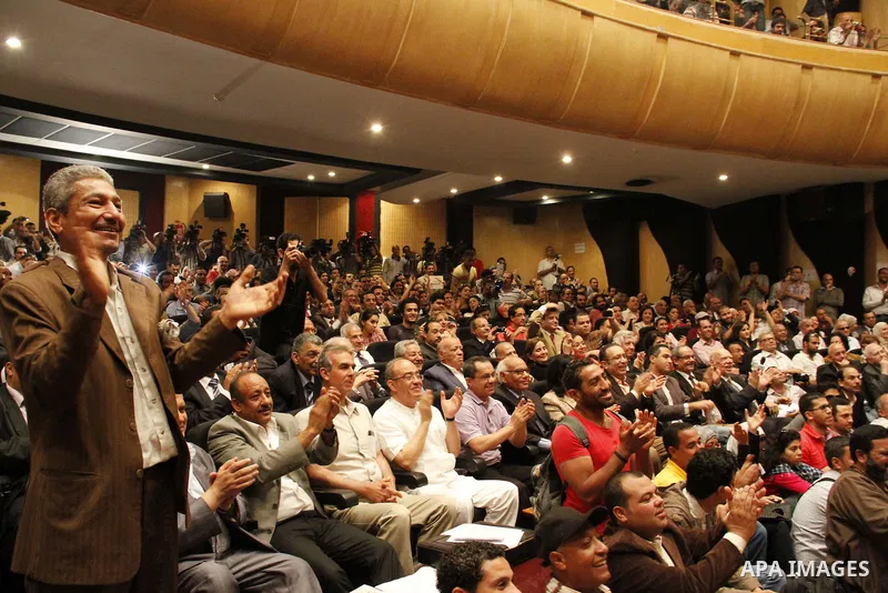 Egyptian Nobel Peace Prize winner and former head of the International Atomic Energy Agency, Mohamed ElBaradei addresses a press conference with novelist Alaa al-Aswany and other personalities, at the Egyptian Press Synd...