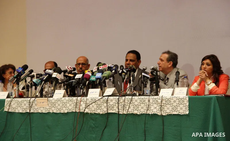 Egyptian Nobel Peace Prize winner and former head of the International Atomic Energy Agency, Mohamed ElBaradei addresses a press conference with novelist Alaa al-Aswany and other personalities, at the Egyptian Press Synd...