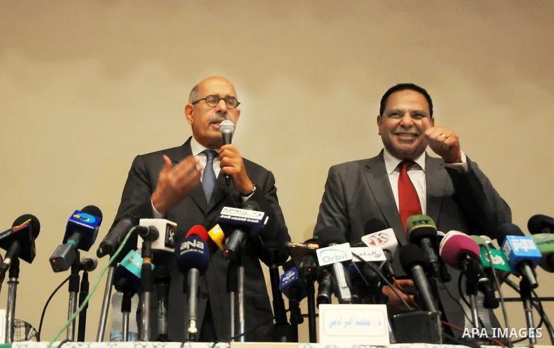 Egyptian Nobel Peace Prize winner and former head of the International Atomic Energy Agency, Mohamed ElBaradei addresses a press conference with novelist Alaa al-Aswany and other personalities, at the Egyptian Press Synd...
